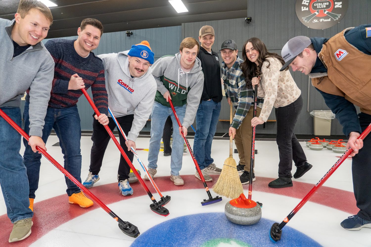 A group being coached on sweeping technique